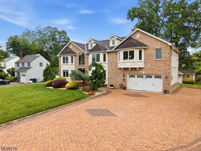 This exceptional custom brick colonial was thoughtfully built showcasing superior craftsmanship and quality finishes throughout.