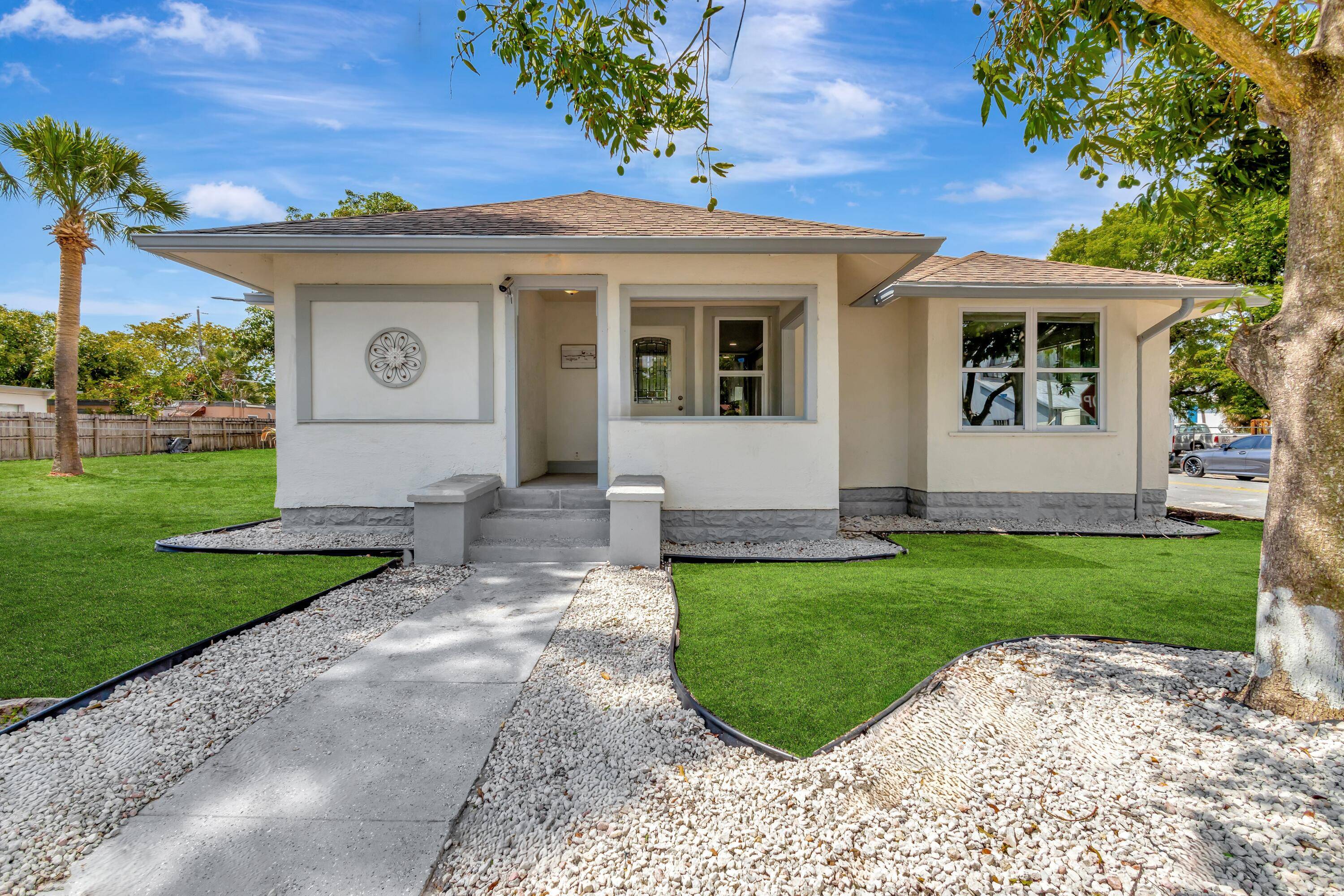 This unique quadplex features a 3 bedroom, 2 bathroom single family home, a triplex, and a vacant lot.
