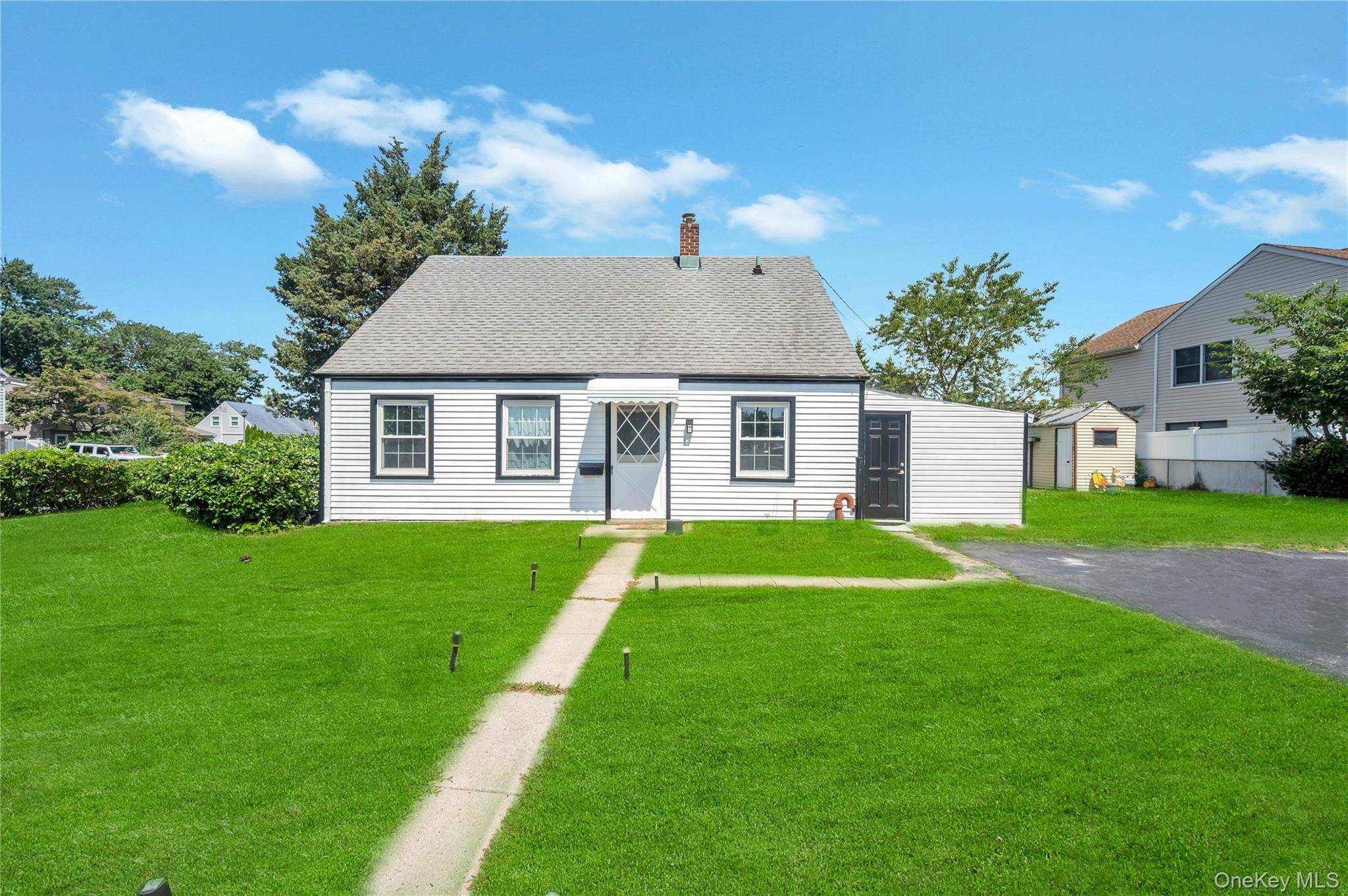 Welcome to this charming and beautifully updated 4 bedrooms, 2 bathrooms cape house in the heart of Levittown.