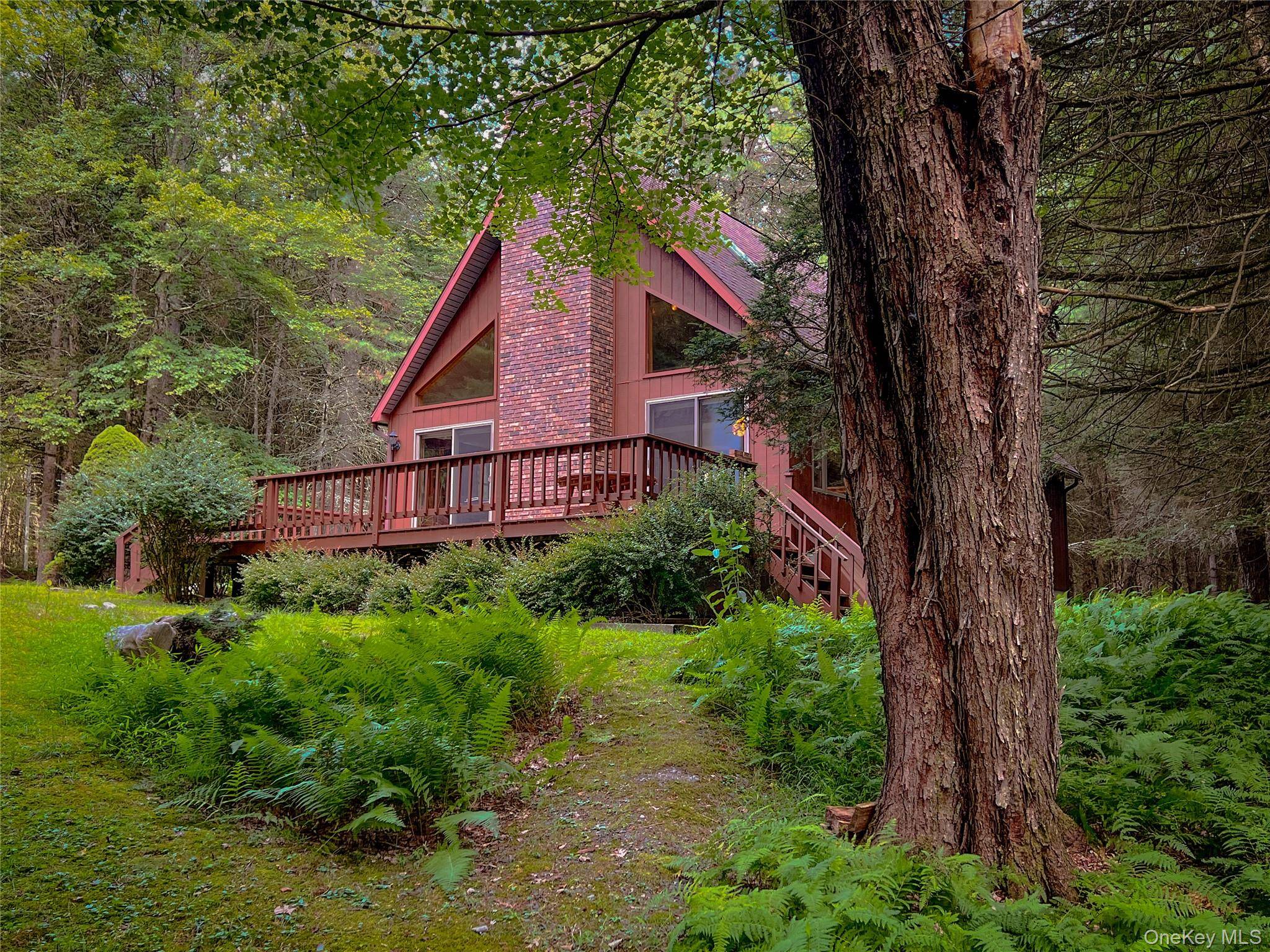 Located in the pristine Black Lake Estates in Bethel, NY, this chalet style home is a great blend of comfort and country charm.