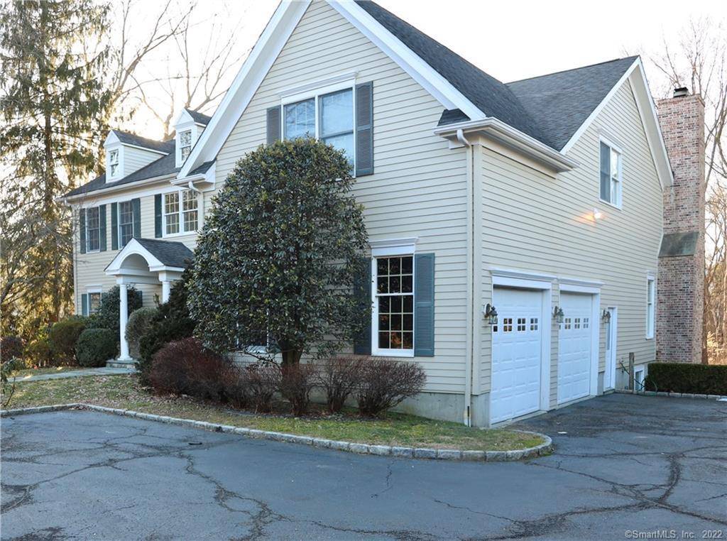 Stately newer colonial home sitting on 2 3 acre level lot.