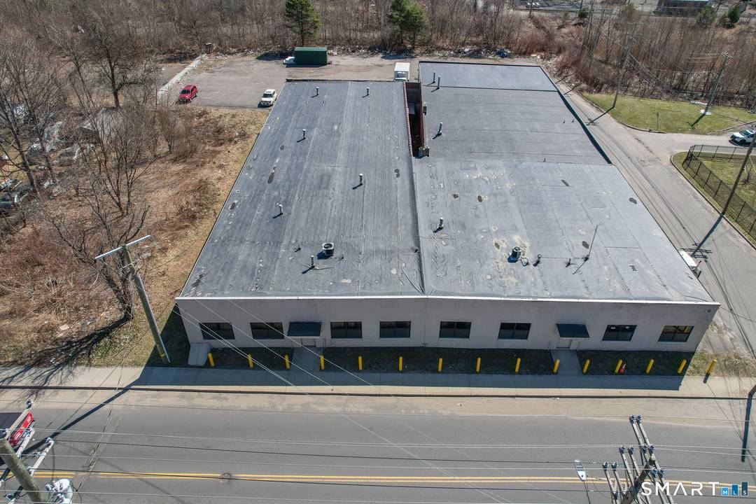 Exponential Potential Abounds with this 5 Parcel Under developed, RM Zoned Moderate Density Multi Residence parcel currently being utilized as light industrial on only a fraction of the parcel.