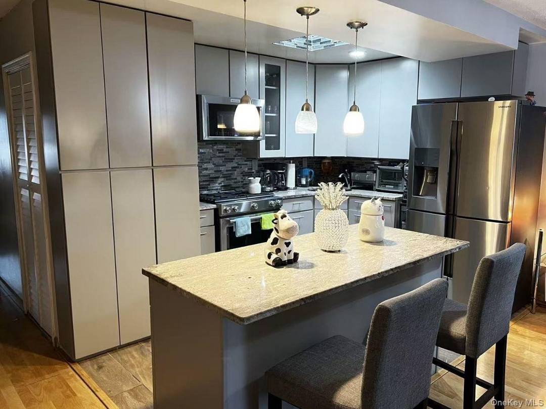 This well maintained three bedroom, two bathroom condominium is located in a private, gated community in the desirable Fresh Meadows neighborhood.