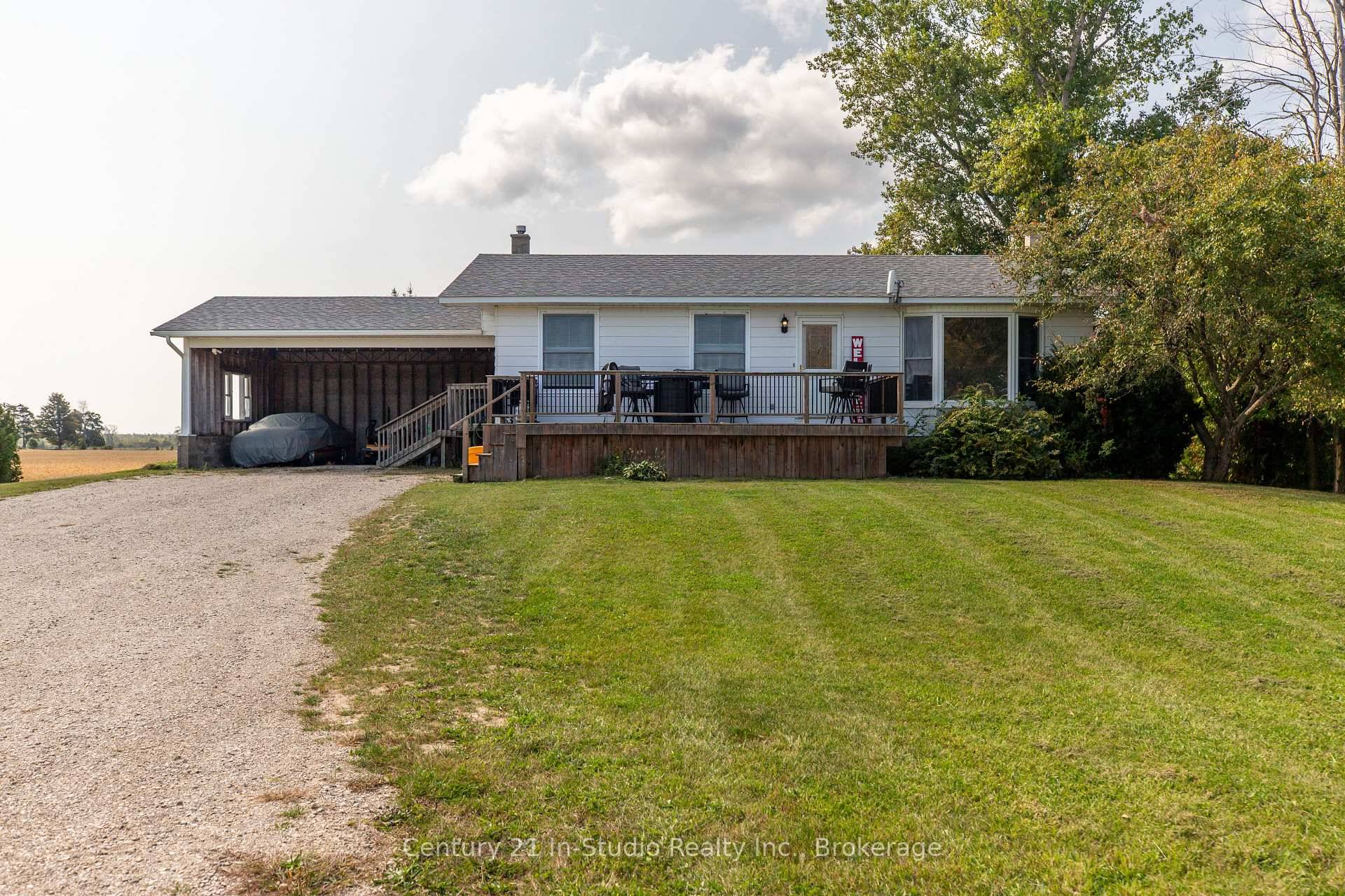 Welcome to this beautifully updated bungalow set on a large 1 acre lot, surrounded by open farmland and peaceful countryside.