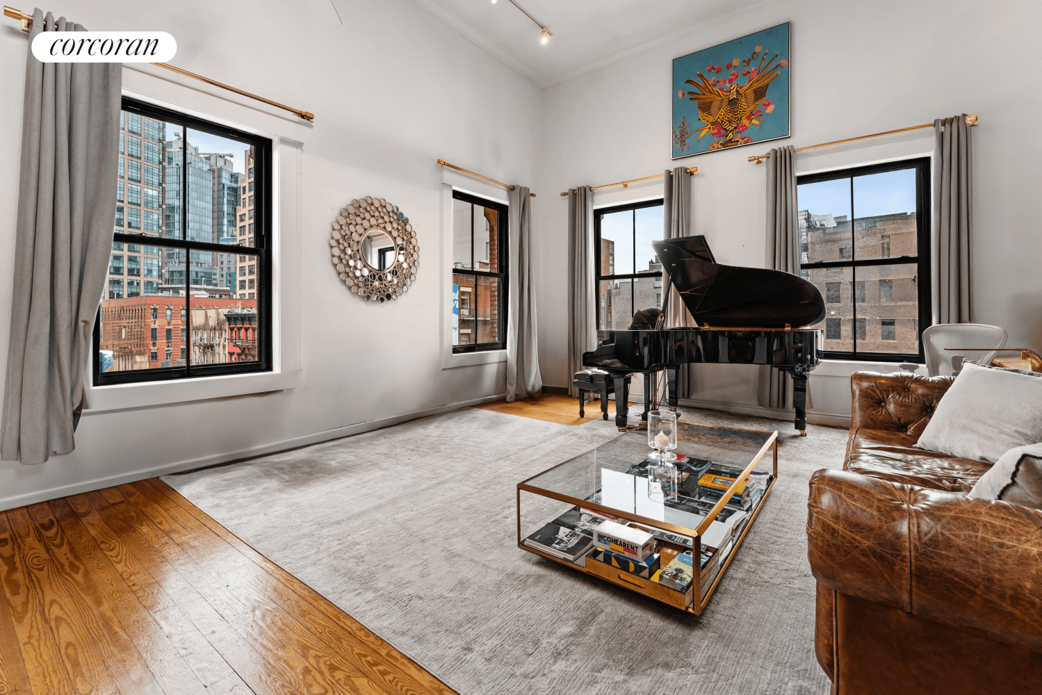 Perched on the top floor of a charming four story walk up, this full floor duplex loft at 53 Grand Street captures the essence of classic SoHo living.