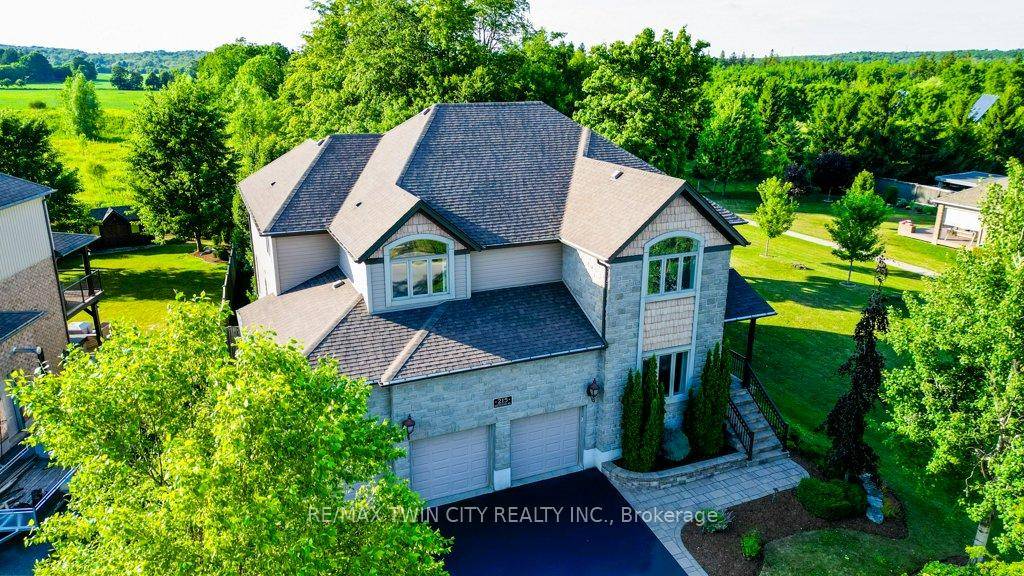 Exquisite custom built home set on a quarter acre lot, offering nearly 5, 000 sq ft of luxurious living space, including a fully finished walkout basement.