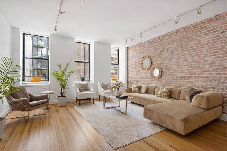 BEST PRICED TRIBECA LOFT WITH HUGE STORAGE ROOMPotential for exposed brick !