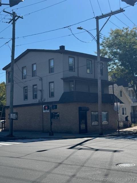 Mixed use property featuring 4 residential units and 1 commercial space in a prime New Haven County location.