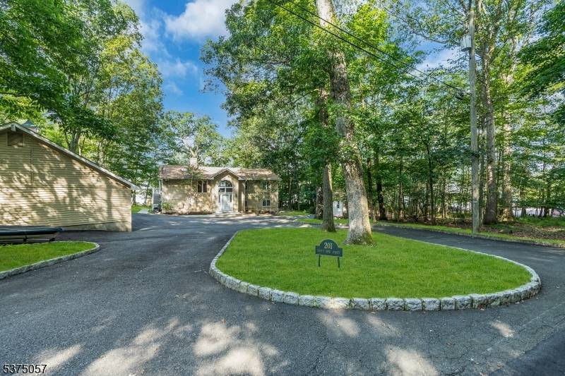 A rare opportunity to own a private premier lakefront estate on the shores of Lake Hopatcong.