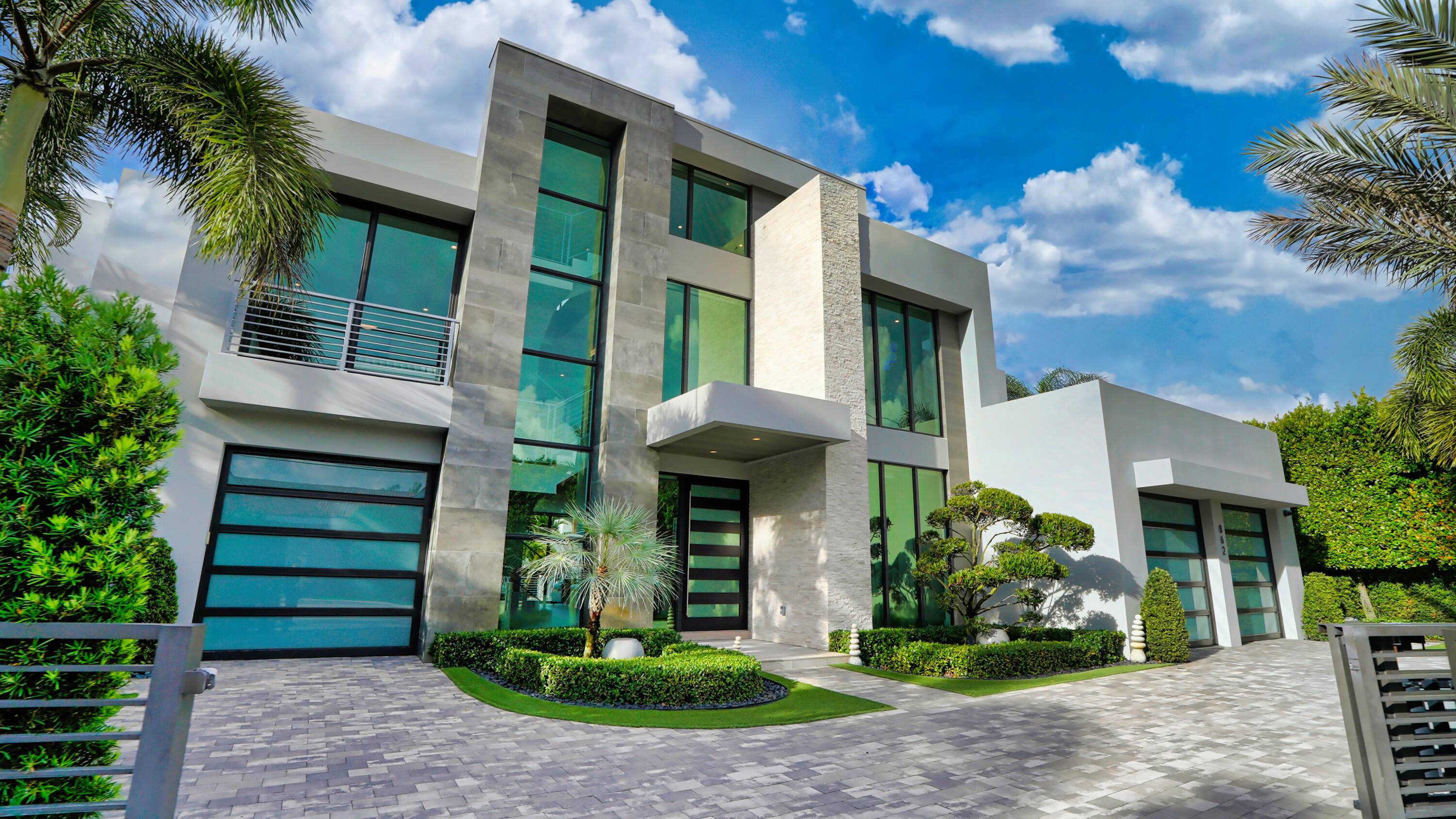 Sleek Modern 3 level Lake Rogers Isles deepwater estate sited on 125 feet of waterfrontage, one off the point with rare Spanish River Park wooded views and originally built by ...