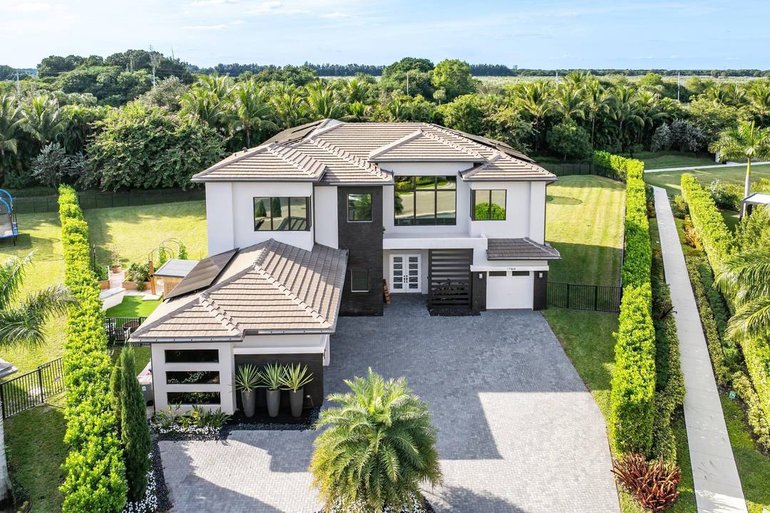 Nestled behind the prestigious gates of Boca Bridges, this 6 bedroom contemporary Palermo is ideally situated at the end of a cul de sac on over half an acre of ...