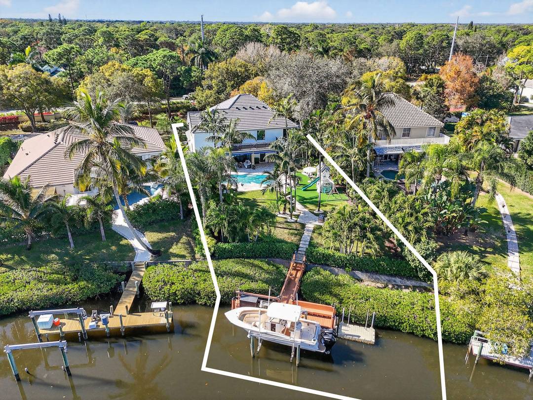 Tucked within the quaint and coveted boating enclave of Loxahatchee Pointe, this beautifully appointed waterfront residence at 19954 Loxahatchee Pointe Drive captures the essence of Jupiter's active, coastal lifestyle.