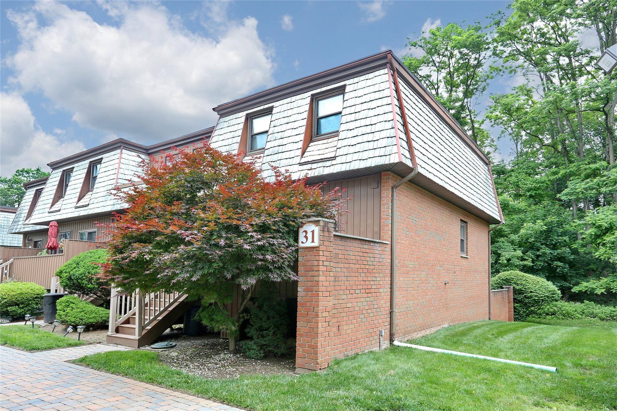 Heart of New City ! Just off Main Street, this spacious condo offers three levels of comfortable living with a layout perfect for both relaxing and entertaining.