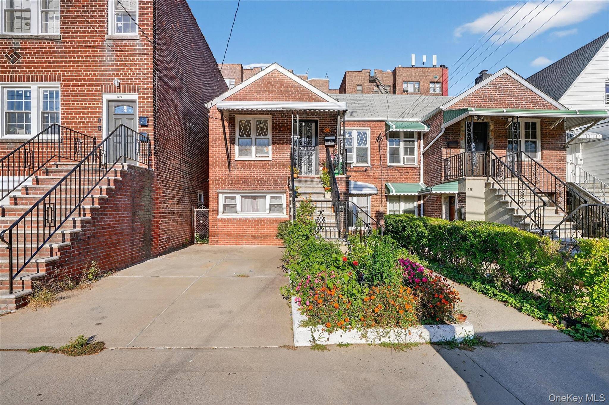 Large brick semi attached two family in Morris Park.