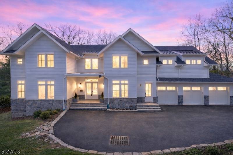Exceptional new construction minutes from NYC offering approximately 9, 600 square feet across three finished levels.