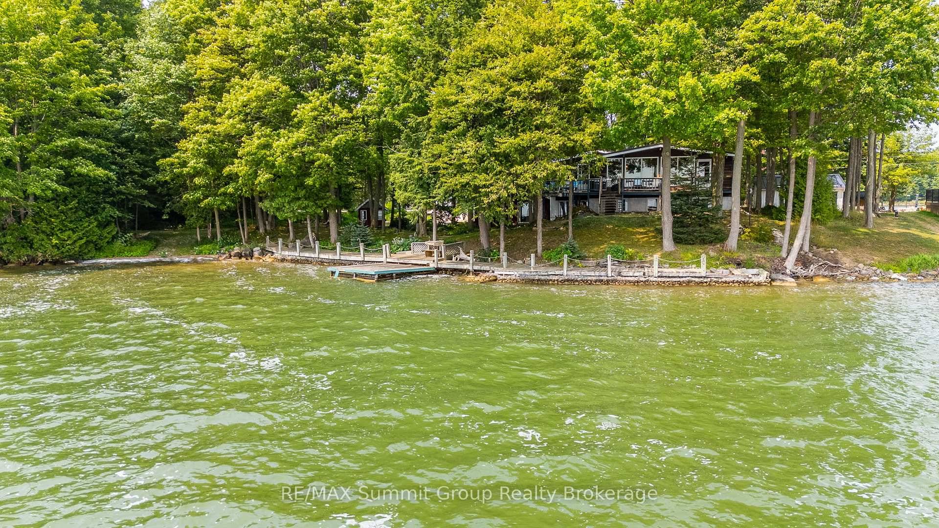 Where the shoreline stretches wide and the seasons play out at your front door, this Lake Eugenia property delivers space, privacy, and four season fun.