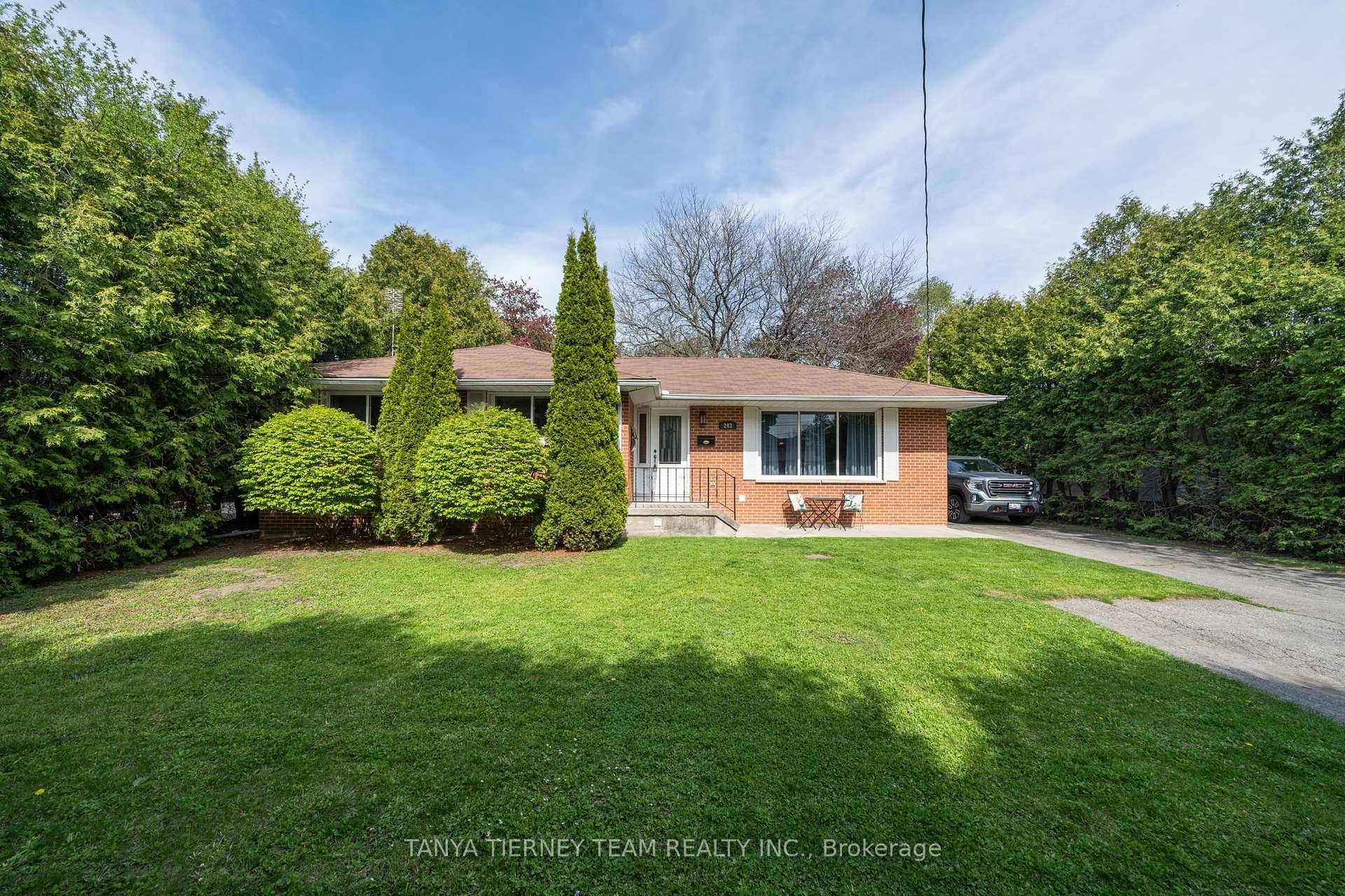 Nestled on a mature 75x200 ft lot this upgraded, all brick bungalow features a detached insulated garage workshop with hydro !