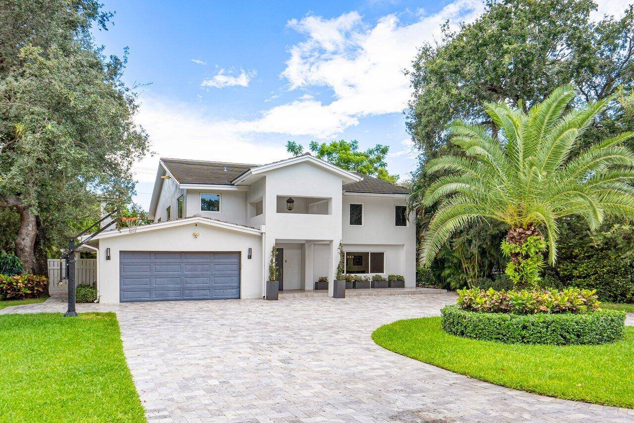 Exquisite contemporary residence situated in the highly coveted Palm Beach Farms community of Boca Raton.