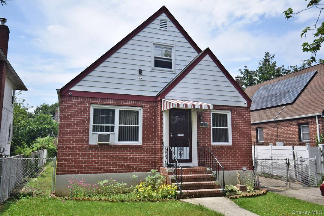 Beautifully Kept Brick Cape with Detached Garage, a finished basement with outside entrance amp ; Private Driveway.