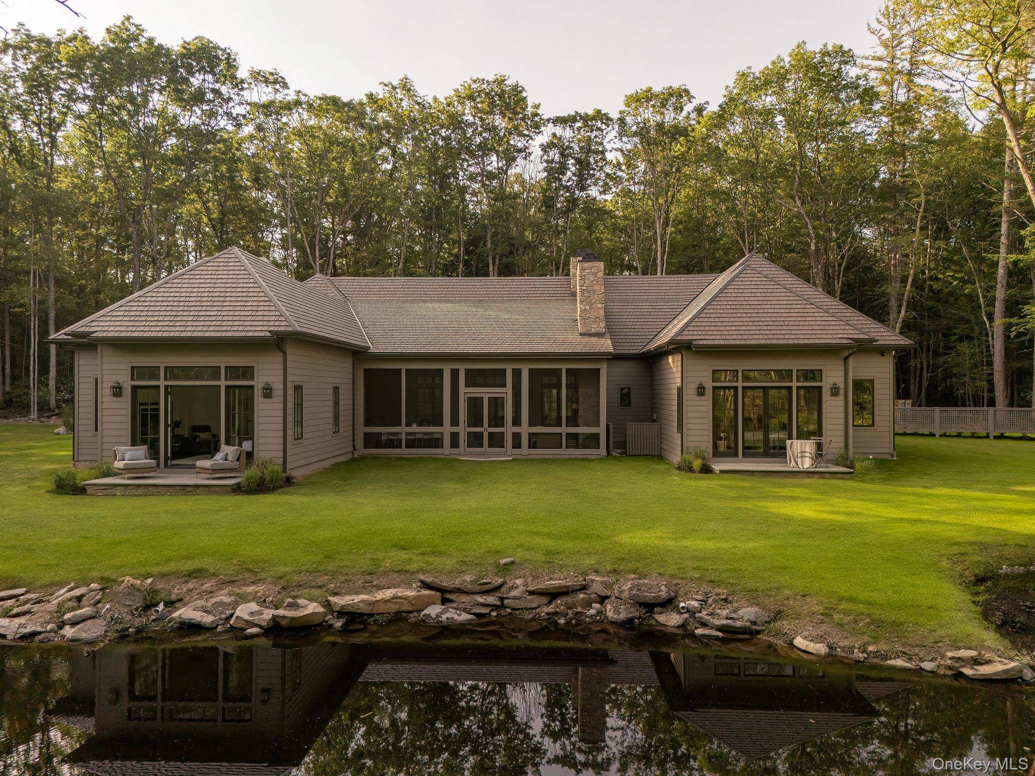 Welcome to Bucky s Pond. A long, private driveway lined with tall pines and mountain laurel leads you to this newly built home, sited on ten acres with a beautiful ...