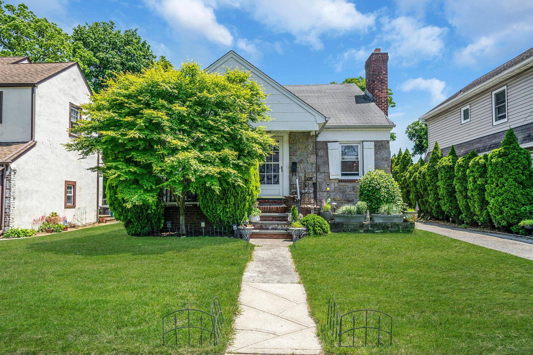 Welcome to this charming Cape style home nestled in the heart of Lynbrook !
