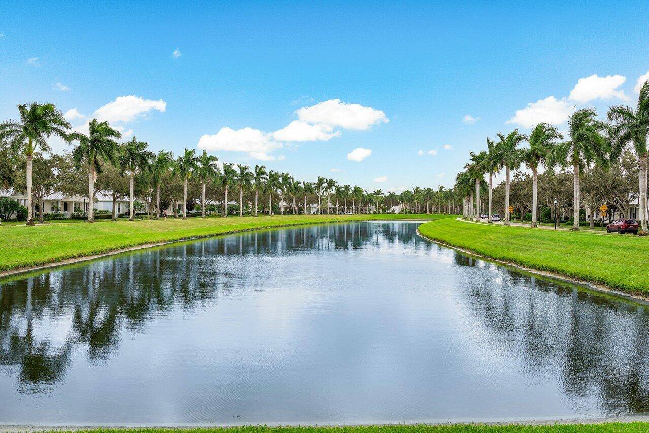 Rarely avail Lake front Key West style end unit townhouse located in Abacoa's most desired neighborhood Mallory Creek.