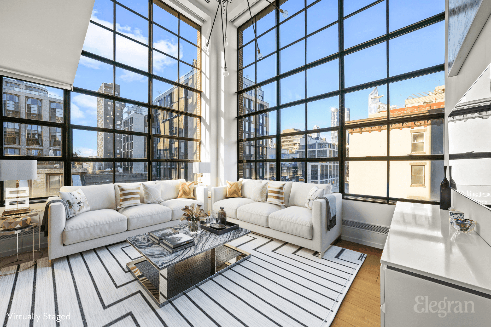 The distinctive charm of this corner duplex begins with its impressive 20ft double height ceilings.