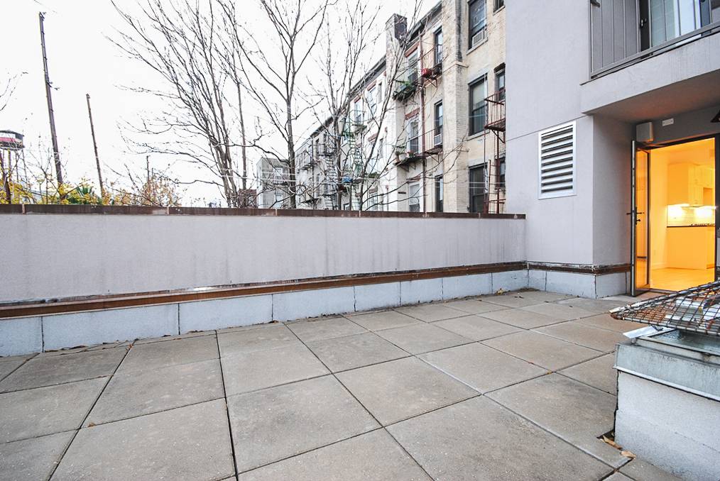 OUR THOUGHTS This home faces the rear of the building and includes a large private patio, shared with one other unit, just off of the living room.