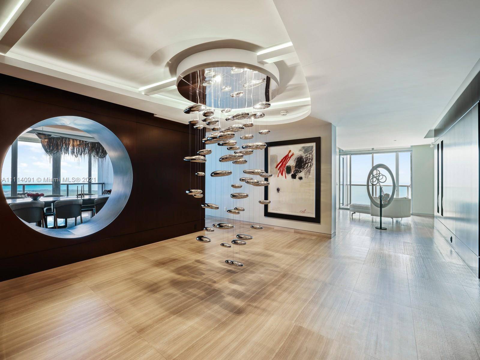 Contemporary design melded w timeless elegance is found in this one of a kind 67th floor PH w over 8, 800 sq ft on top of the world renowned Four ...
