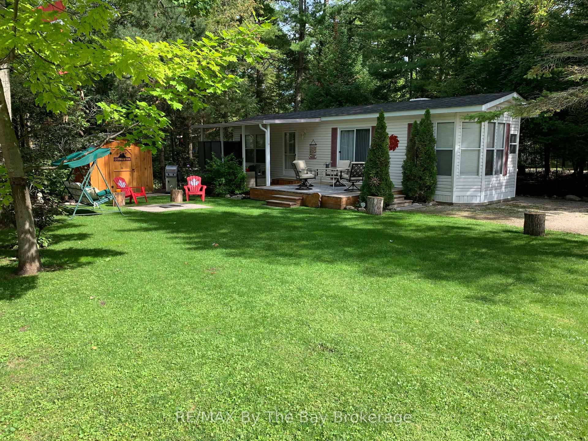 Nestled in a secluded haven within the beloved Countrylife Resort, this Huron Ridge Resort Cottage 2001 invites you into a world where summer dreams unfold effortlessly.