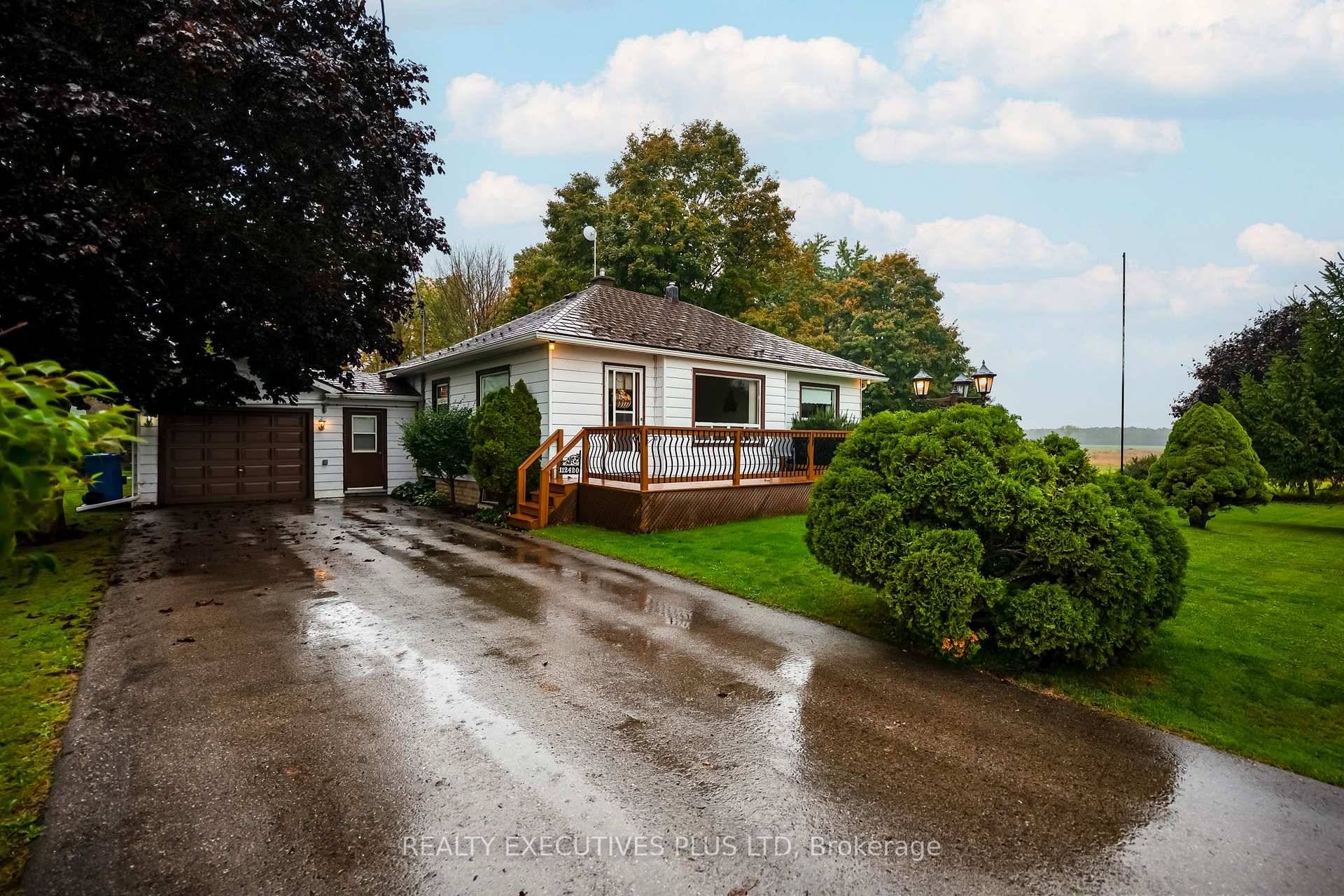 Charming Well Cared For Bungalow On A Gorgeous Landscaped Estate Lot.
