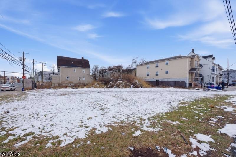 This three family house boasts nine bedrooms and six bathrooms and each unit offers a built in laundry.