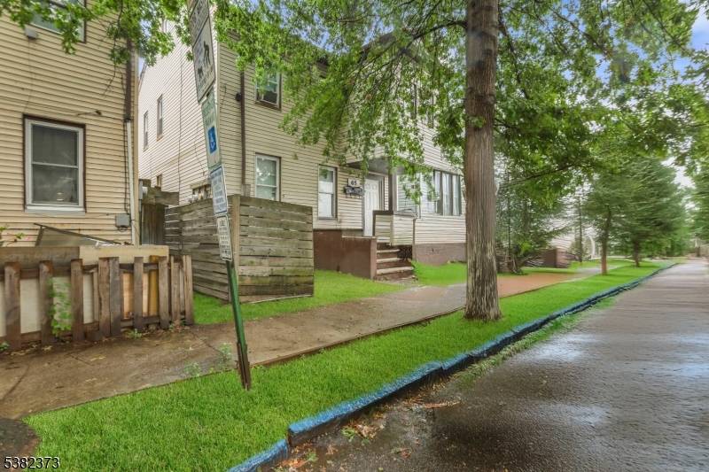 Welcome to 65 N 1st Street, a beautifully renovated two family home offering both comfort and investment potential in Paterson.