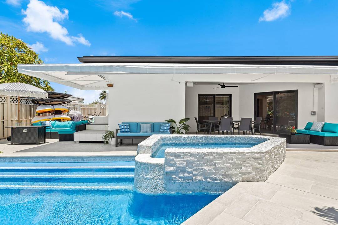 Experience coastal luxury in this fully updated 5 bedroom, 4 bath waterfront home with ocean access in East Pompano.