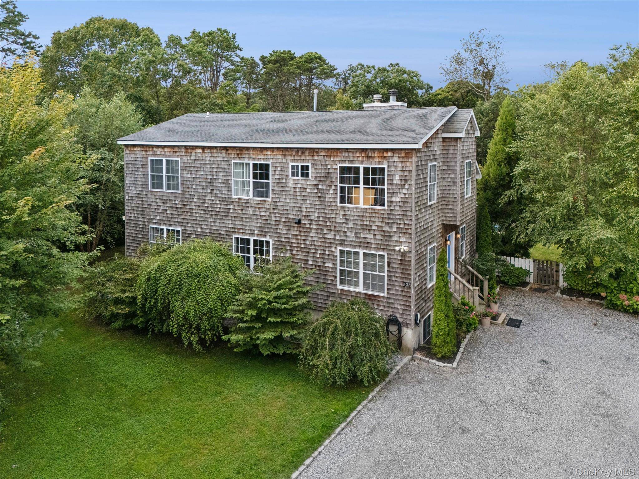 Discover the charm of this contemporary four bedroom home nestled on nearly one acre of private land.
