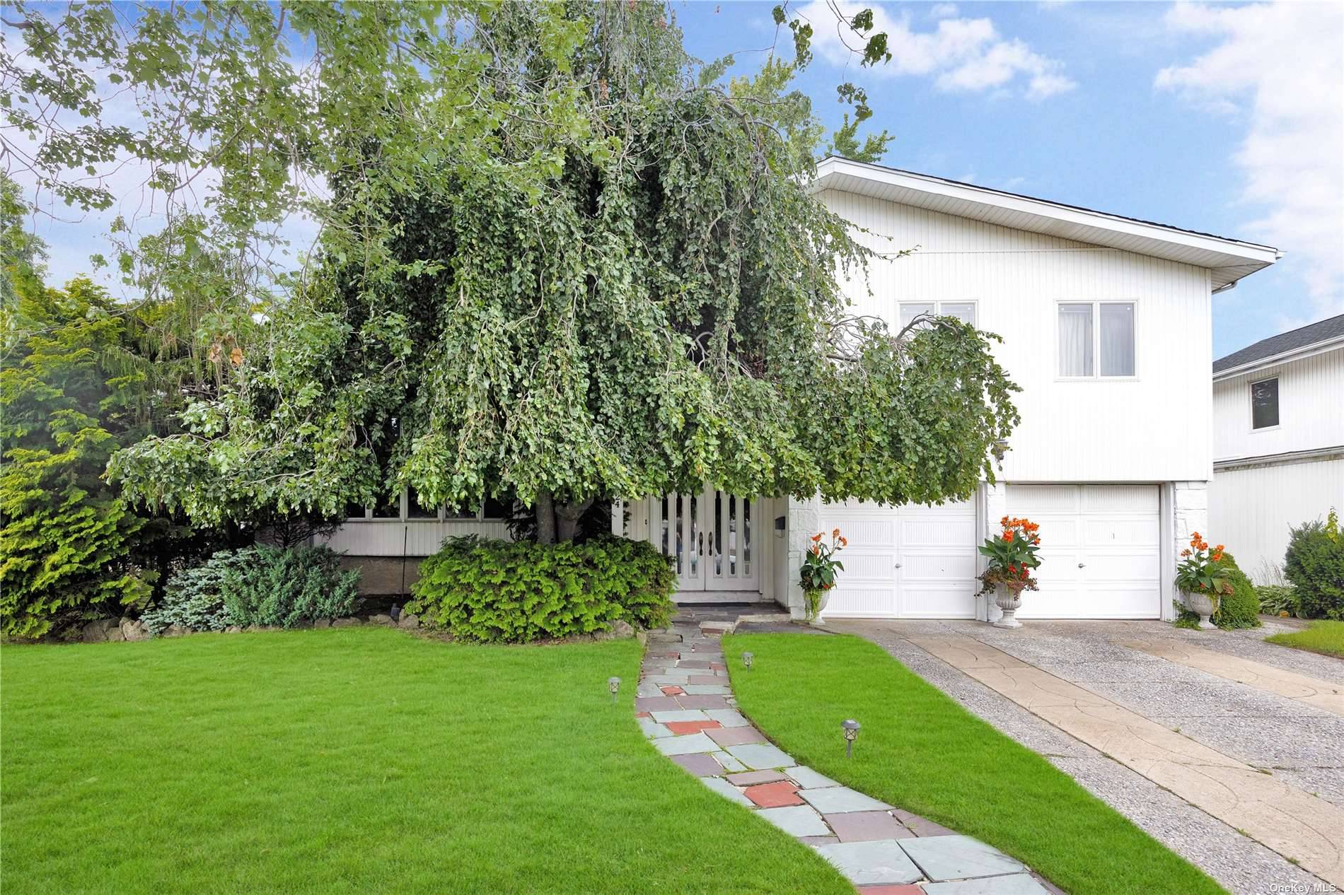 A fantastic opportunity to get a spacious home with large rooms in North Woodmere !