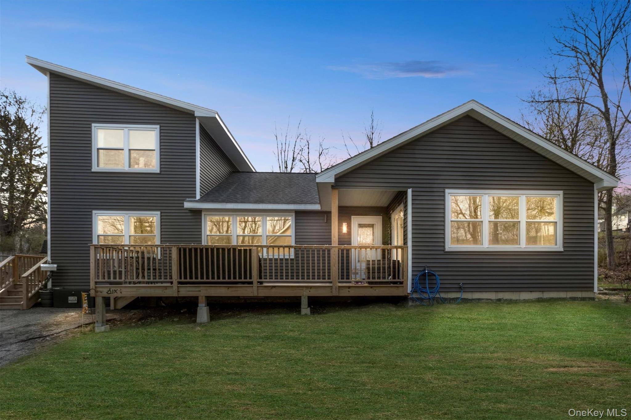 Welcome to this beautifully updated four bedroom, three bath contemporary ranch with an accessory apartment in Highland, Ulster County.