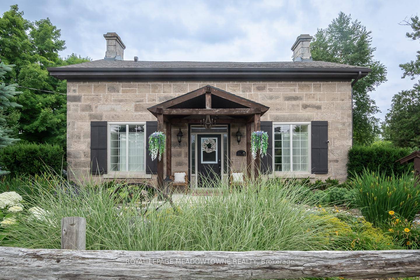 Nestled on over half an acre in the heart of sought after Rural Milton, this extraordinary century stone home offers a rare fusion of timeless elegance and thoughtful modern upgrades.