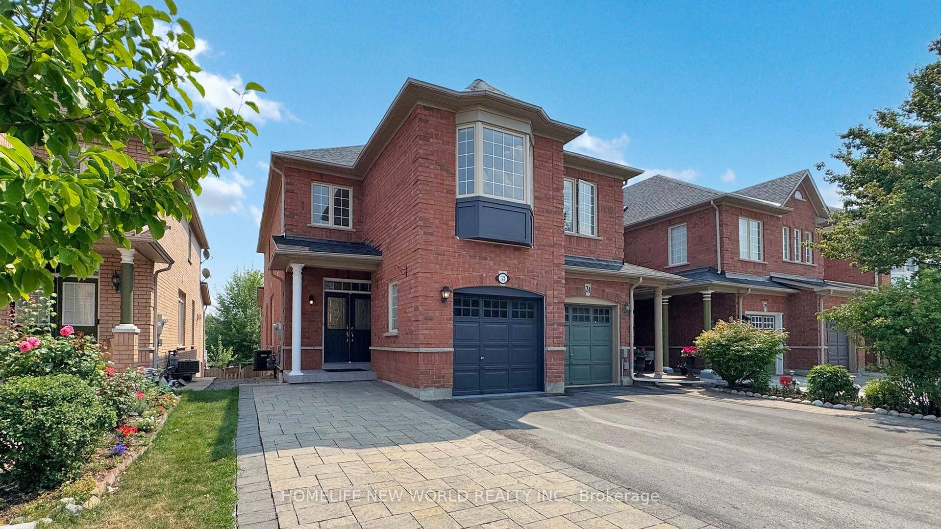 Newly renovated townhouse end unit offering spacious living, including a finished walk out basement, backing onto a serene ravine and pond for enhanced privacy.