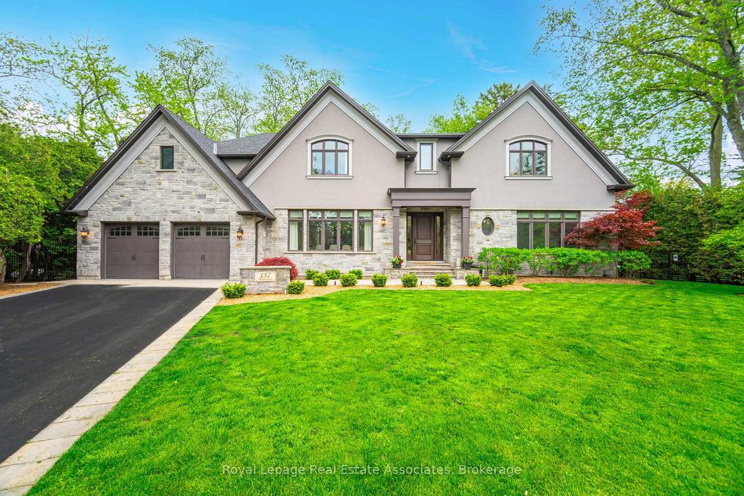 Experience refined family living at its gold standard at 157 Dianne Avenue, an expansive pie shaped lot that offers rare, year round privacy.