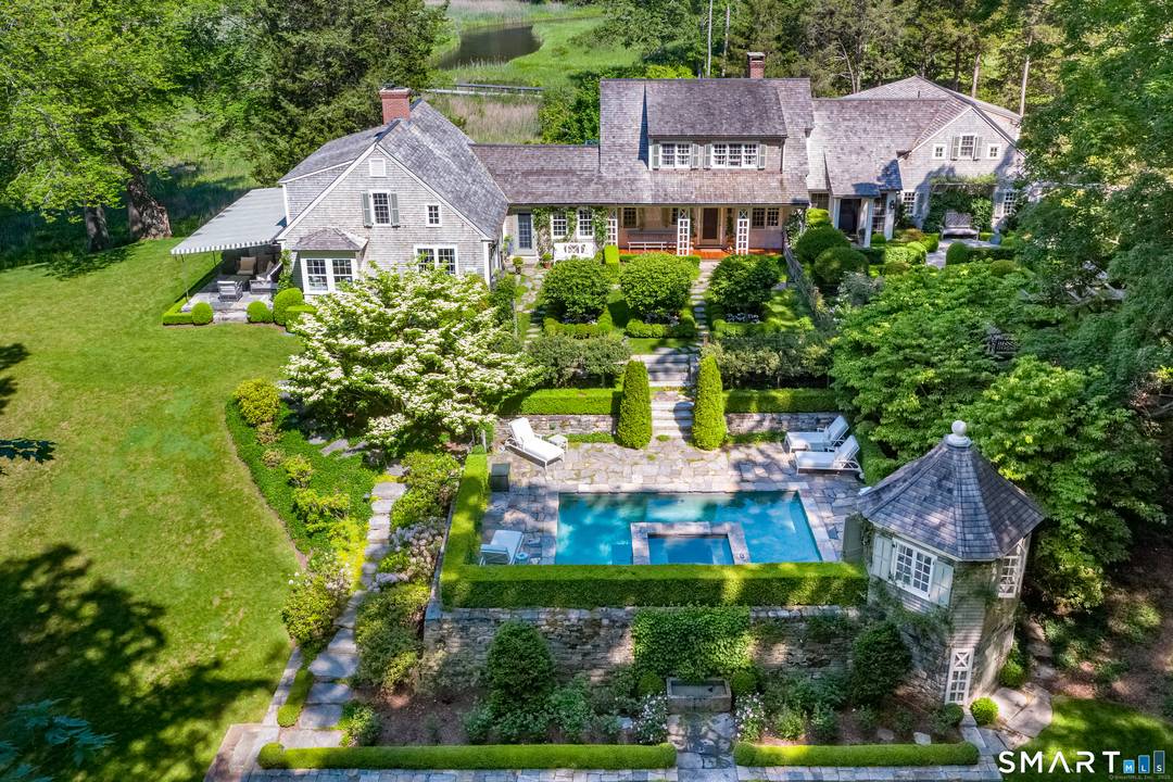 Elevated on a dramatic rise above the Connecticut River, this captivating property, aptly named River Knoll, showcases one of the most breathtaking private settings on the river.
