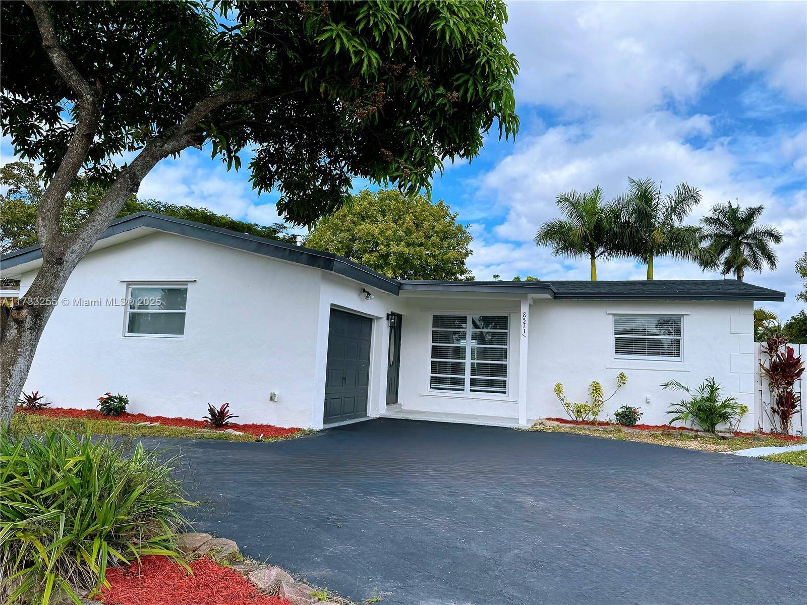 Completely Updated Waterfront home with screen in pool.