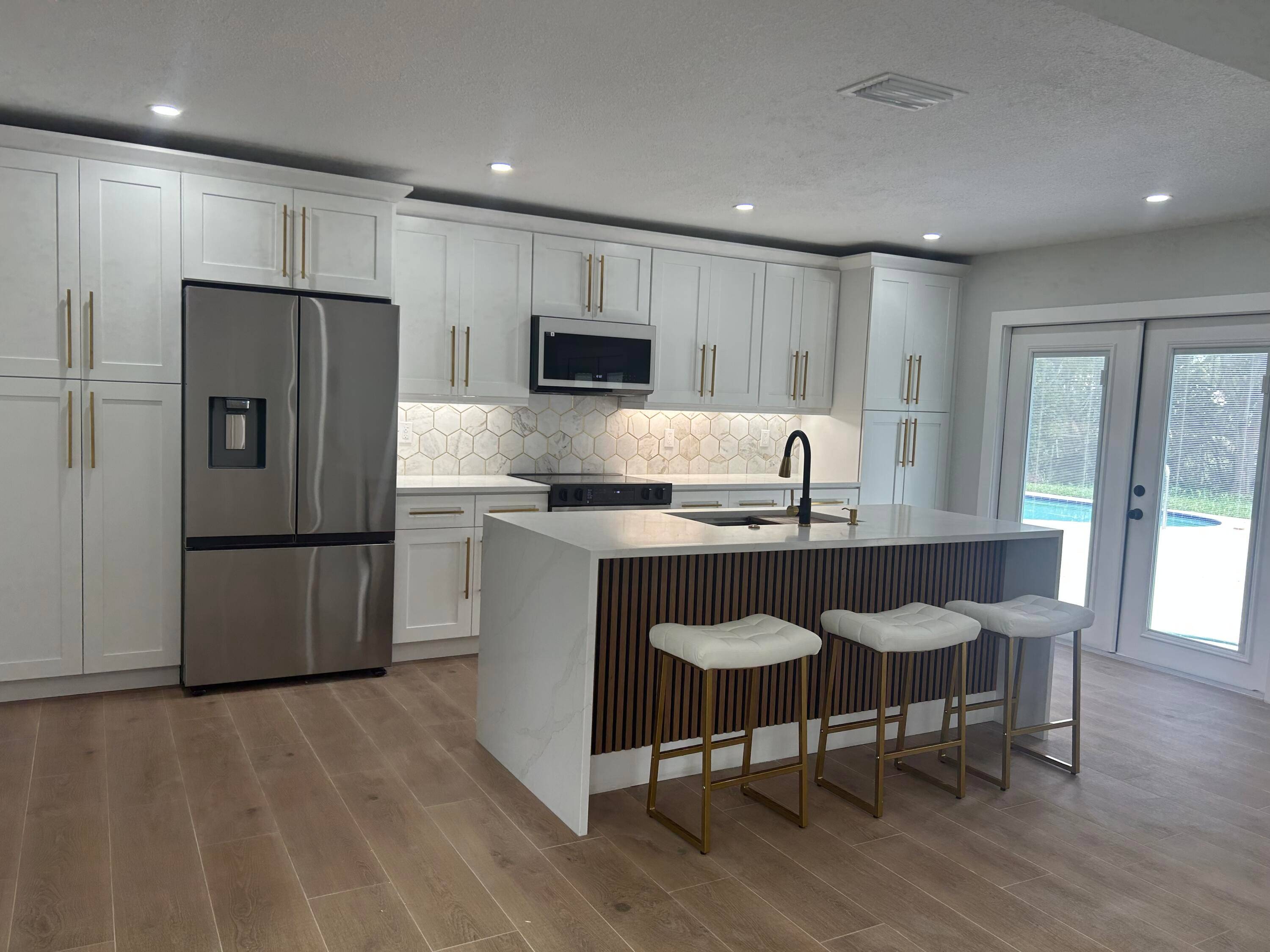 WELCOME HOME to this beautifully redone home that features a 2 BEDROOM GUEST HOUSE WITH SEPARATE DRIVEWAY, ENTRY AND LAUNDRY !