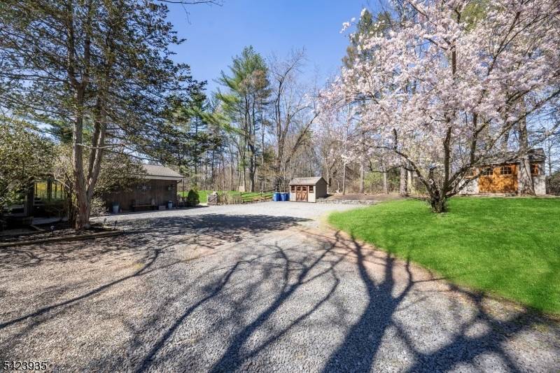 STUNNING best describes this beautifully renovated ranch set on a private, picturesque 1 acre lot.
