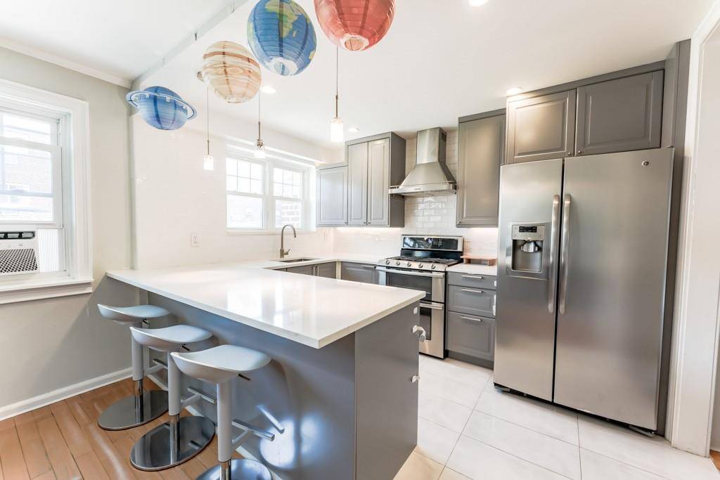 Welcome to 153 18 78th Road, an inviting attached brick home nestled in the heart of Flushing s Kew Gardens Hills.