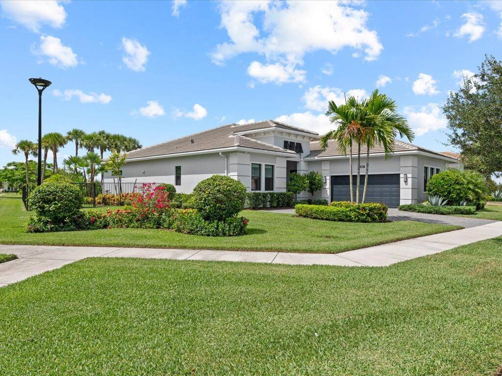 Stunning Corner Lot Estate with Lake Views, Luxurious Upgrades, Custom Pool, and Landscaping Paradise !
