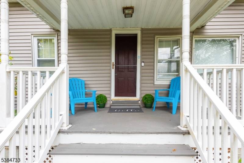 Welcome Home ! Charming Cape Cod timeless character, cozy covered front porch, leads to the great room, beautiful beamed ceilings, stunning stone fireplace, a perfect place for gatherings.