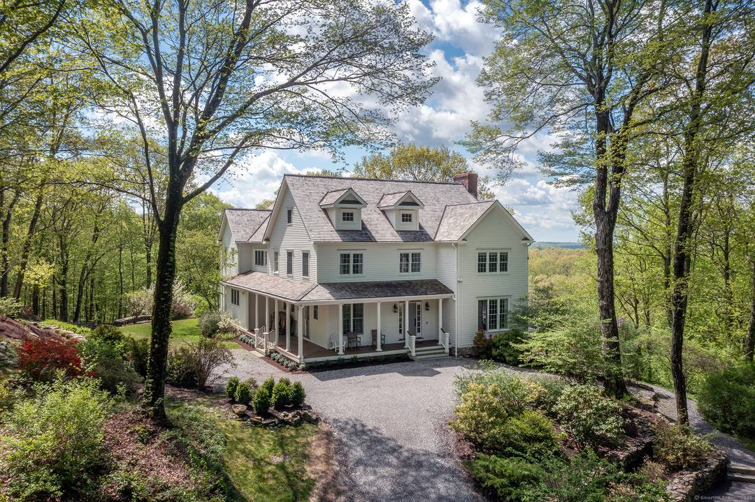 Located along one of Roxbury's most coveted stretches, this property is nestled among an 800 acre greenbelt of farmland and conserved land with plentiful hiking trails.
