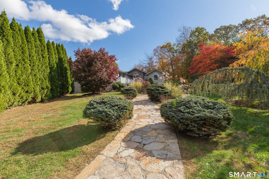 This beautifully expanded ranch offers exceptional indoor outdoor living with an inground pool, outdoor firepit, and multiple entertaining spaces.