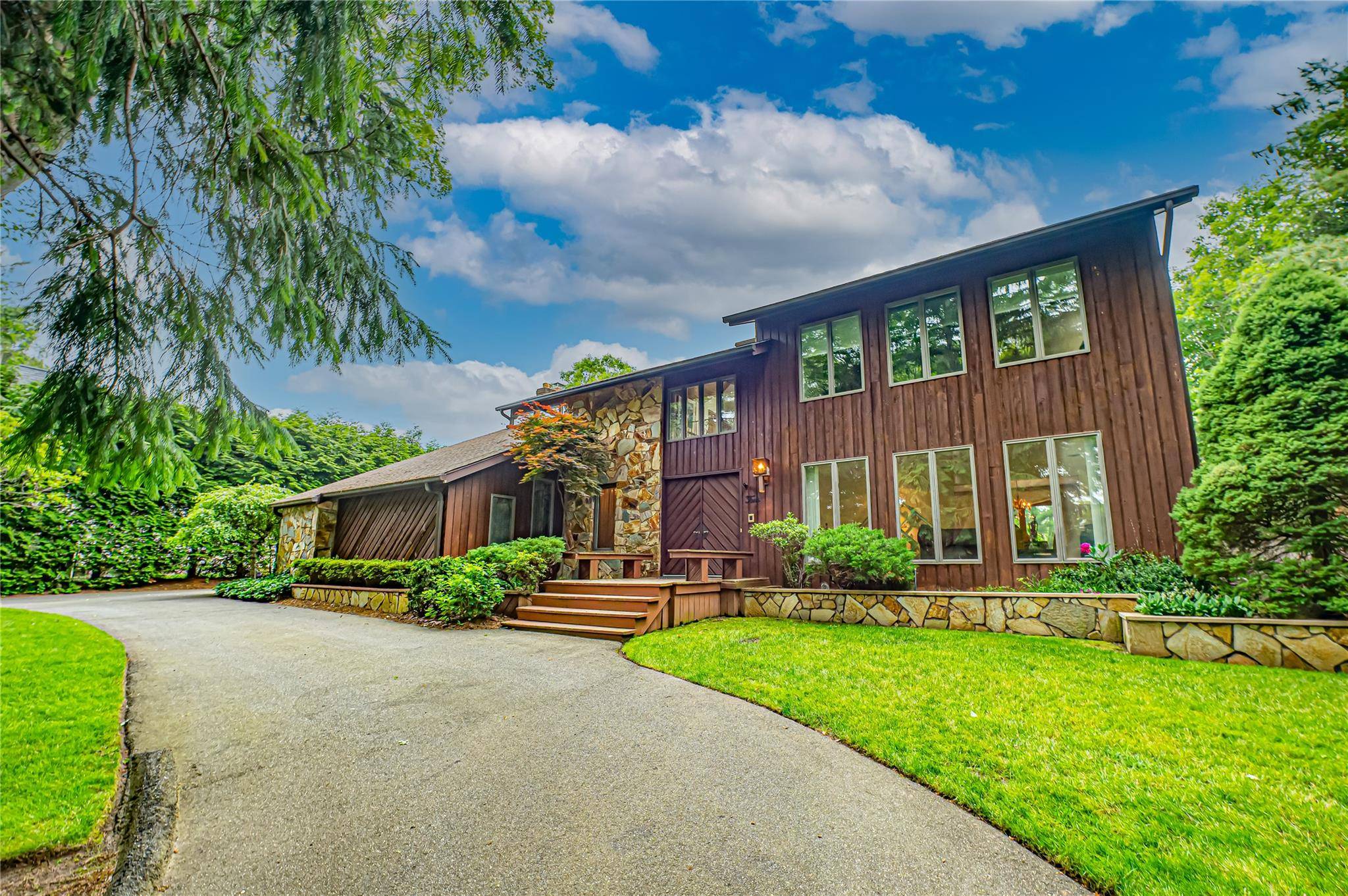 Welcome to this Custom Contemporized Colonial W Two Story Entrance Foyer, Vaulted Ceilings, Two Car Side Entry garage amp ; 3 4 Unfinished Basement.